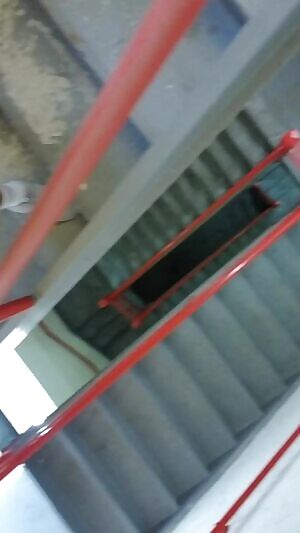 Locked and exposed, threw my clothes down the stairs of an office parking garage