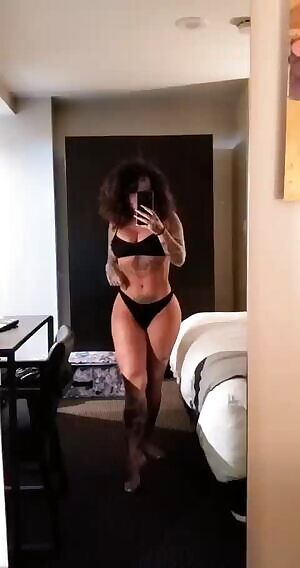 Posing in her hotel room