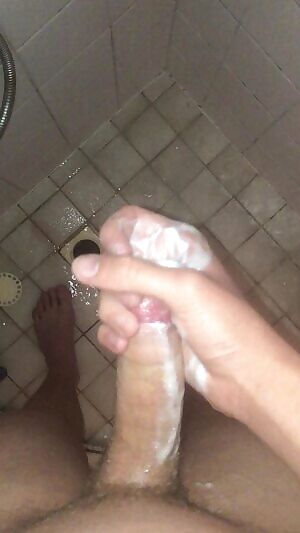 I love stroking my dick in the shower whilst I hear my roommates talk on the other side of the wall