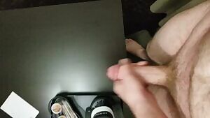 Cumming on a hotel room table